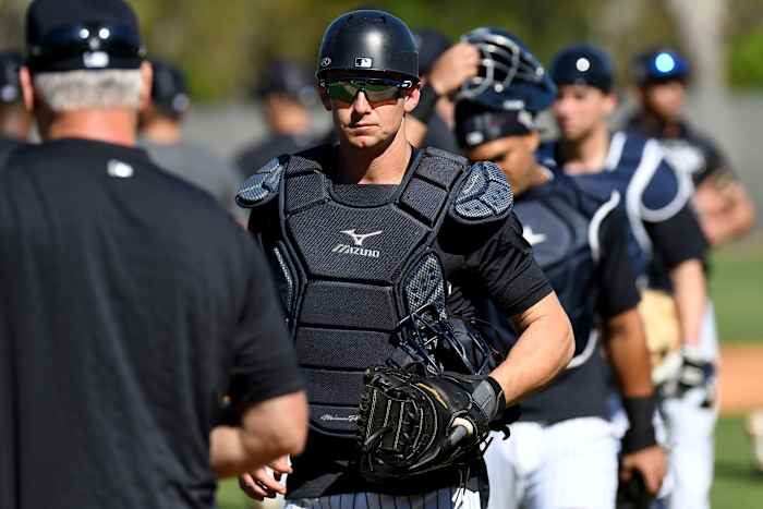 Yankees catcher Rob Brantly participating in catching drills at spring training